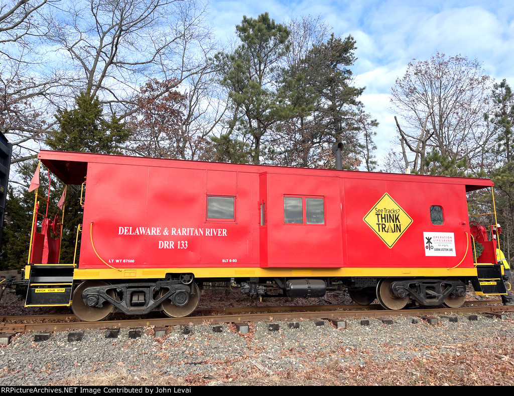 Side view of Delaware & Raritan River Operation Lifesaver Caboose # 133 on the TFT train